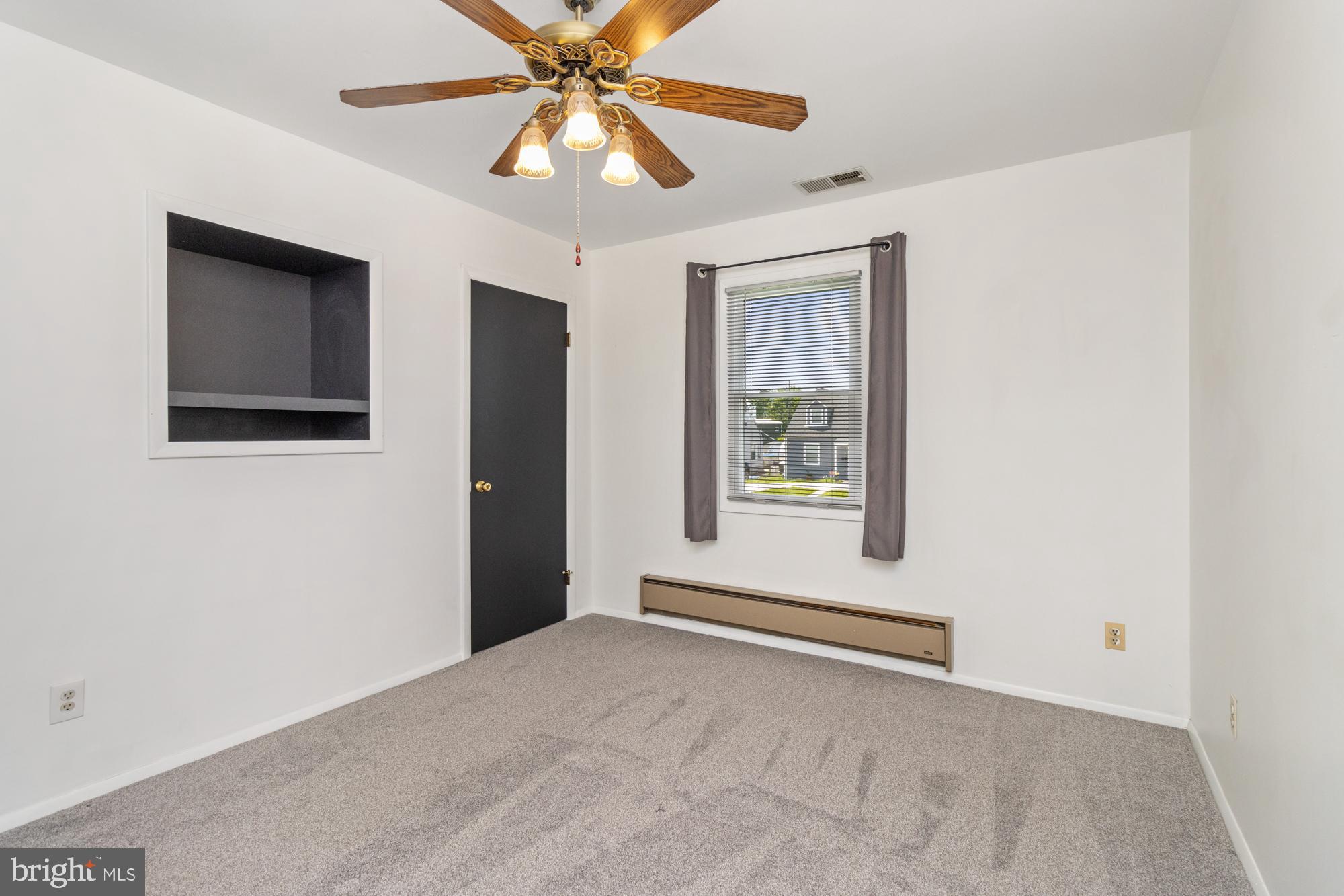 3135 Sollers Point Road Baltimore, MD 21222 - Photo 23 of 36 an empty room with windows and fan