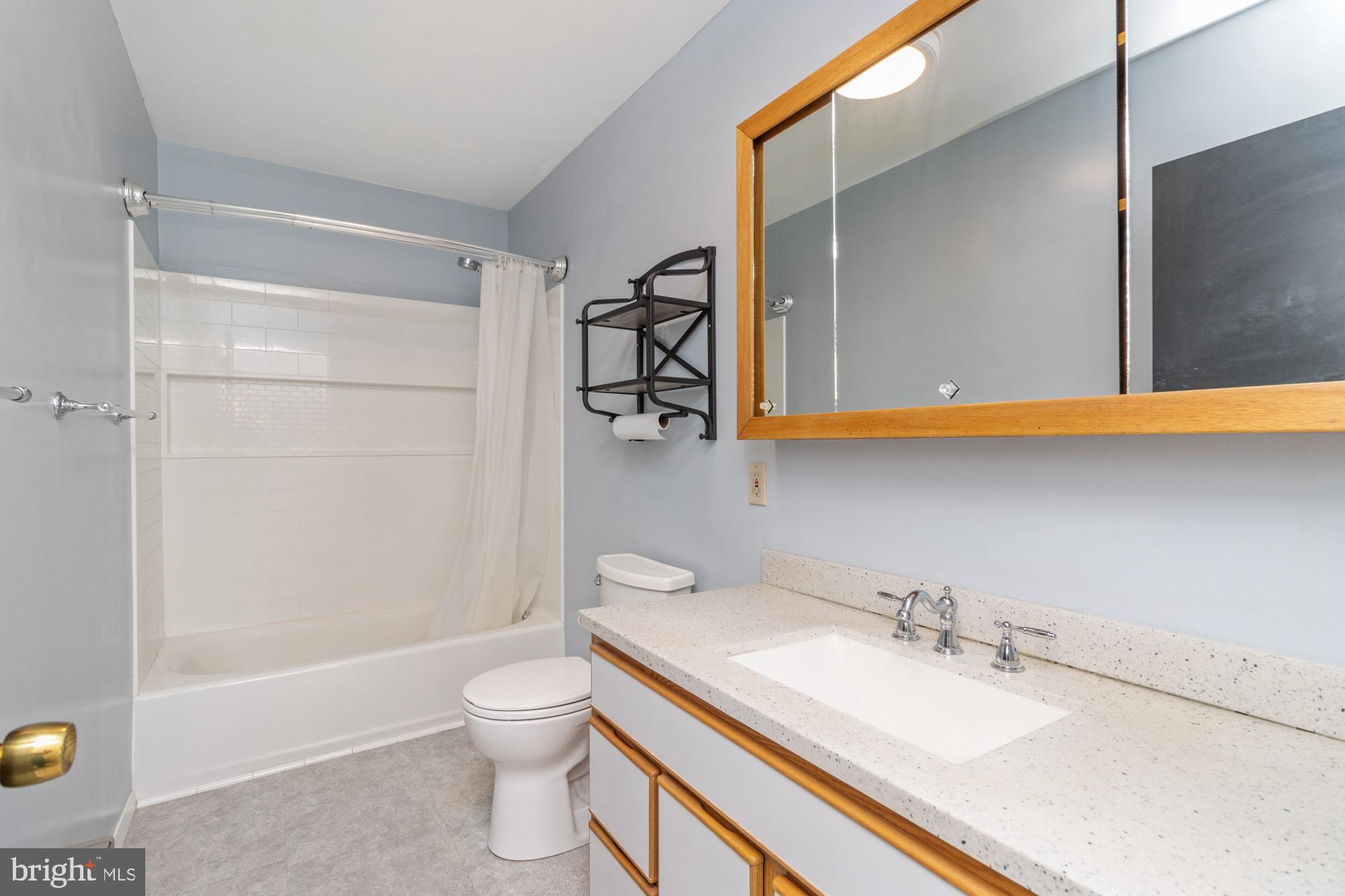 3135 Sollers Point Road Baltimore, MD 21222 - Photo 28 of 36 a bathroom with a sink a toilet and shower