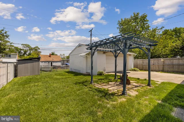 a backyard of a house with a sink yard and entertaining space