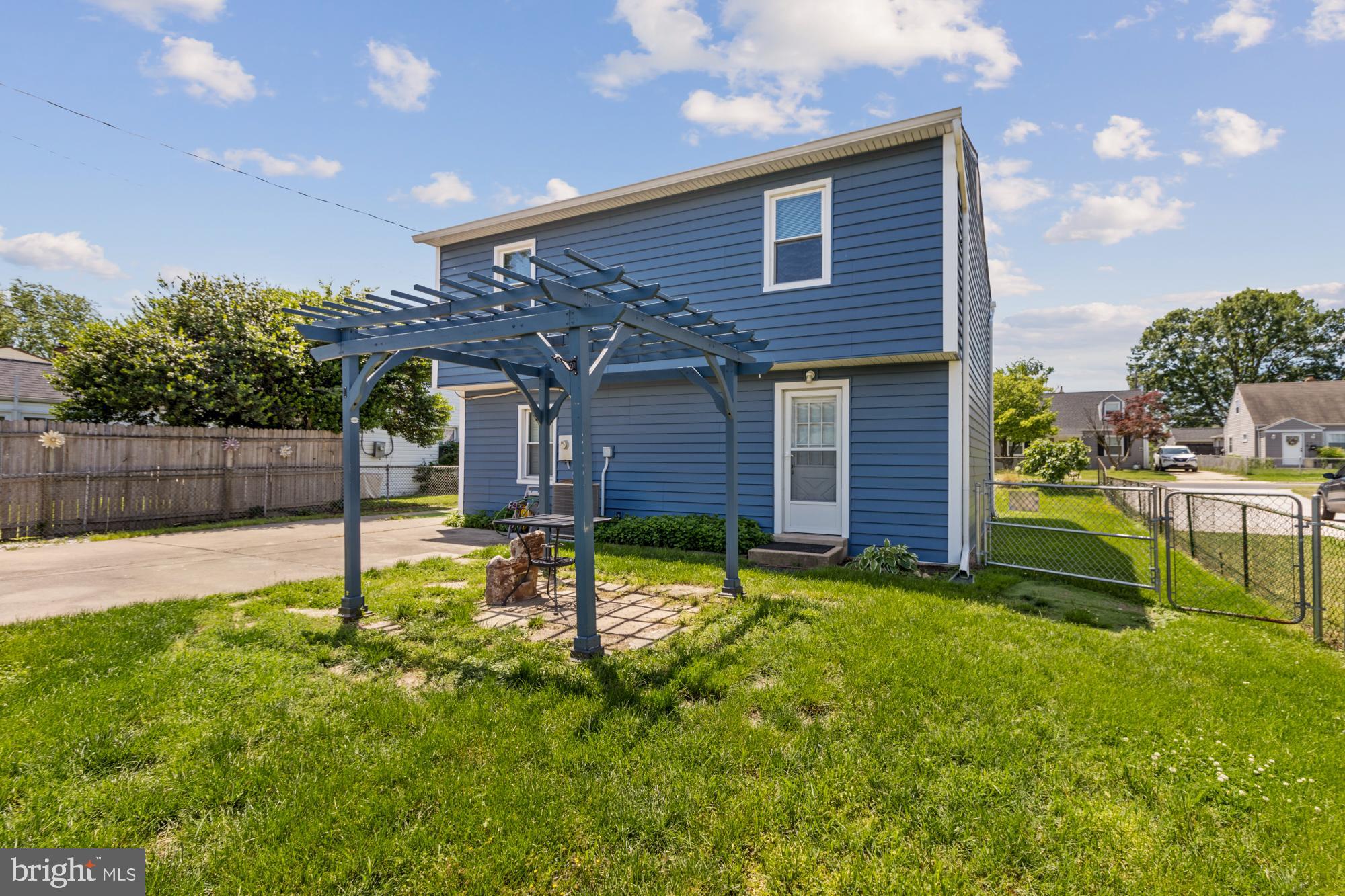 3135 Sollers Point Road Baltimore, MD 21222 - Photo 32 of 36 a backyard of a house with table and chairs