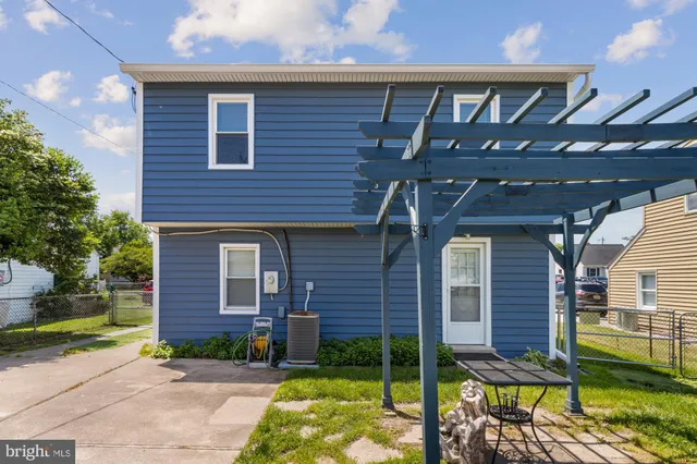 a view of a brick house with a yard