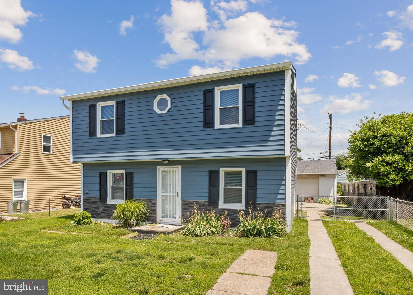 3135 Sollers Point Road Baltimore, MD 21222 - Photo 36 of 36 a front view of a house with garden