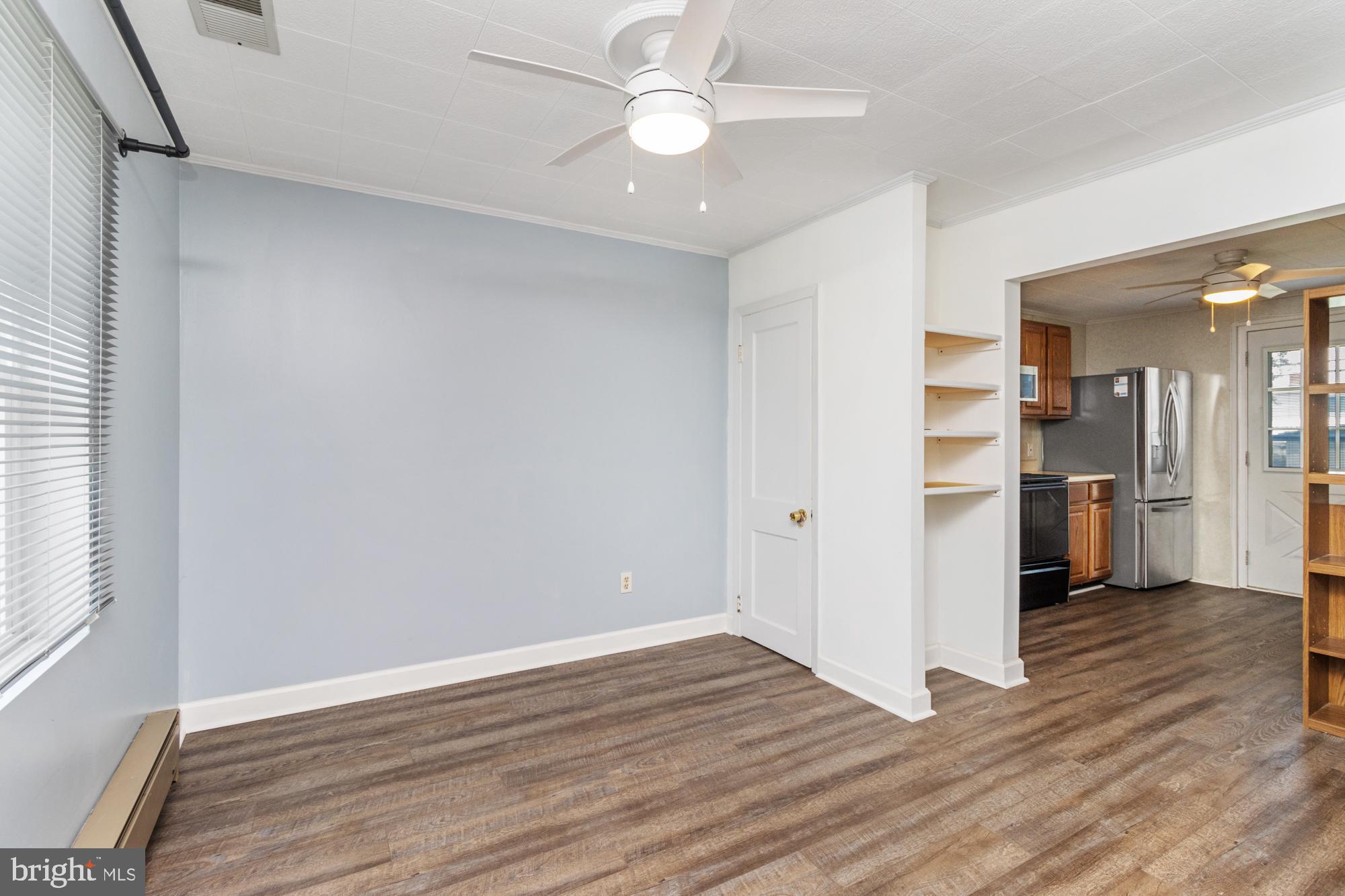3135 Sollers Point Road Baltimore, MD 21222 - Photo 7 of 36 wooden floor in an empty room with a window