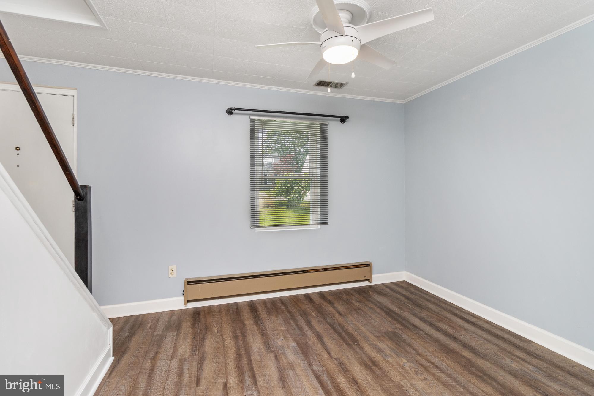 3135 Sollers Point Road Baltimore, MD 21222 - Photo 8 of 36 wooden floor in an empty room with a window