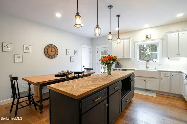 a kitchen with a table and chairs in it