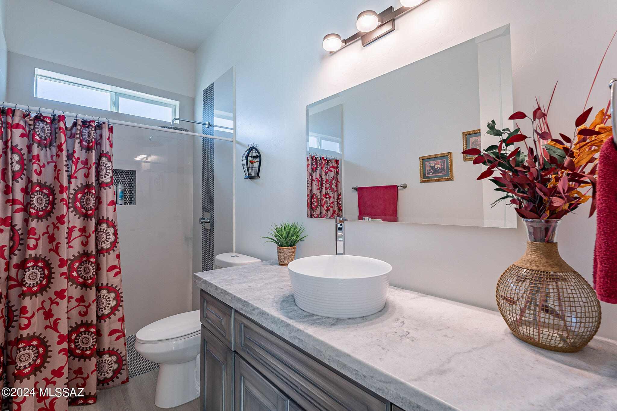 176 Avenida Ostion Rio Rico, AZ 85648 - Photo 36 of 48 a bathroom with a sink toilet and shower