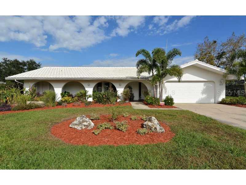4535 Glebe Farm Road Sarasota, FL 34235 - Photo 1 of 1 a view of a house with a yard