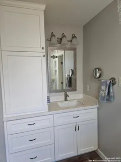 a bathroom with a sink and a mirror