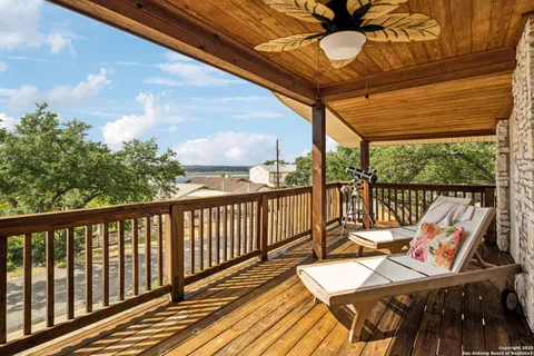 a view of a balcony with furniture