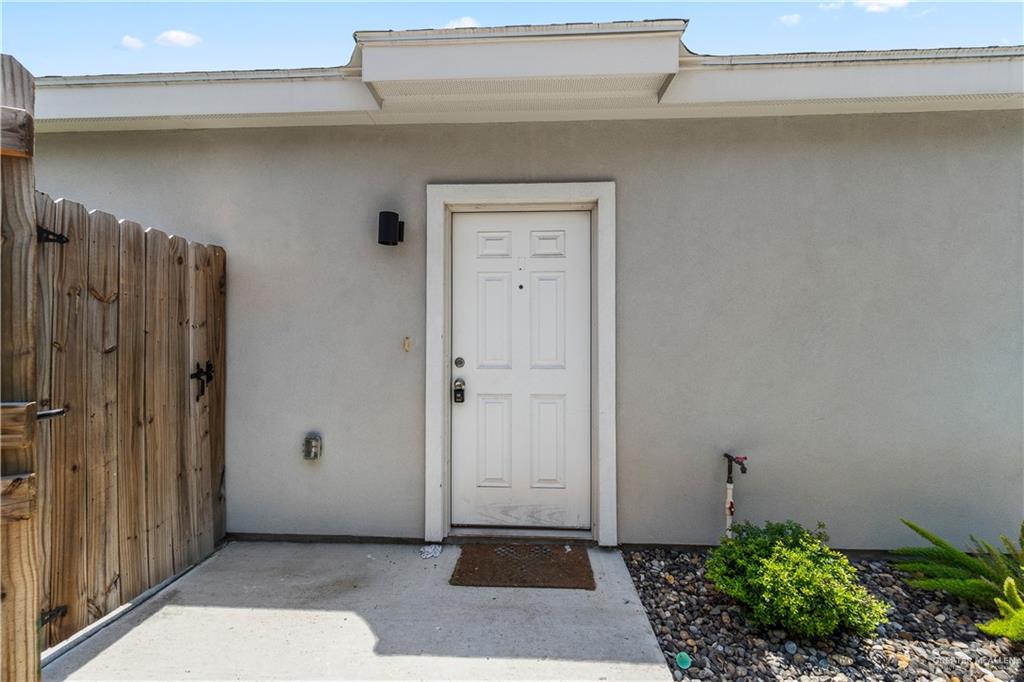 912 Kentucky Street Alton, TX 78573 - Photo 11 of 21 a view of a hallway with wooden shelves