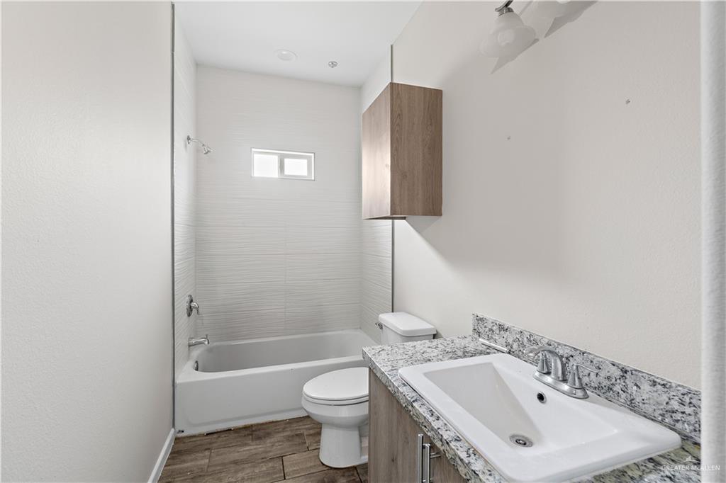 912 Kentucky Street Alton, TX 78573 - Photo 8 of 21 a bathroom with a sink toilet and shower