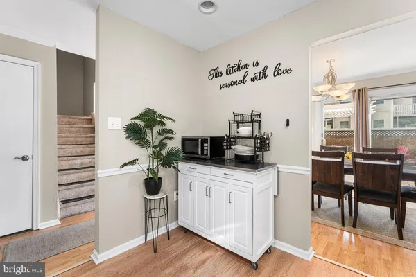 a view of kitchen with cabinets and wooden floor