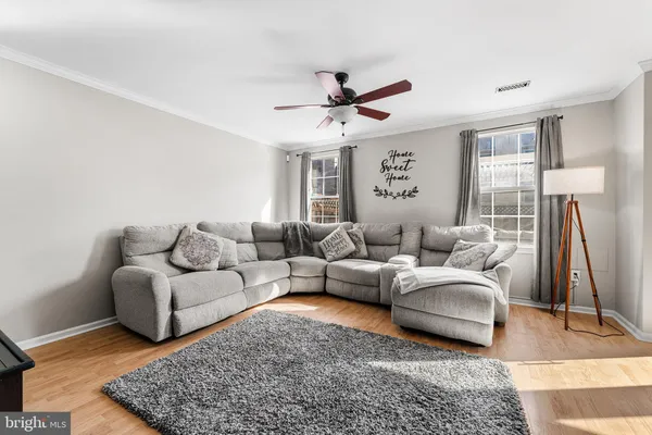 a living room with furniture a rug and a rug