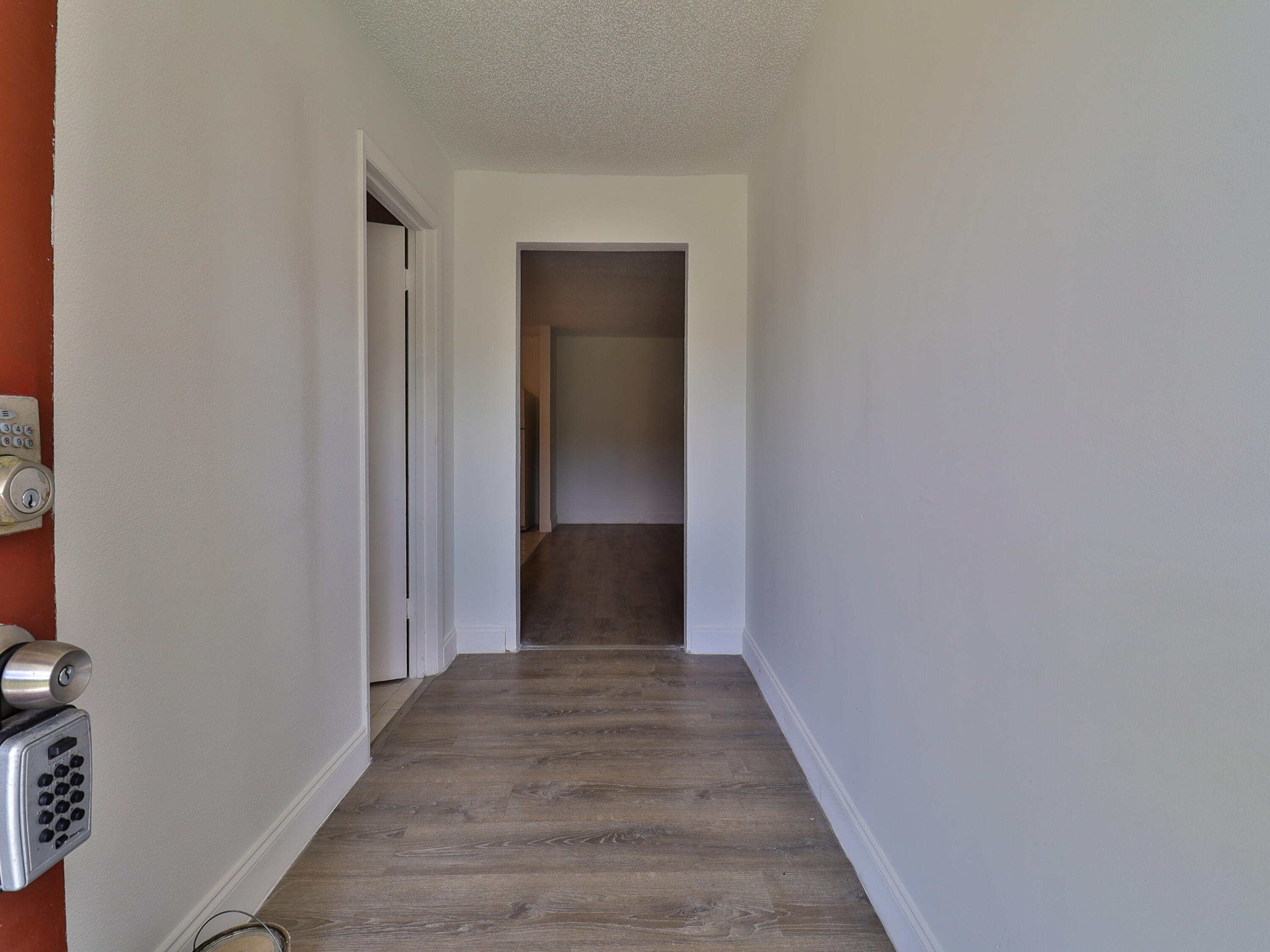 3024 West Dixie Boulevard Fort Pierce, FL 34946 - Photo 7 of 26 a view of a hallway with wooden floor