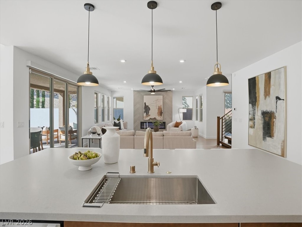 9725 Starlight Ridge Avenue Las Vegas, NV 89148 - Photo 7 of 47 This open concept kitchen and living area is perfect for gatherings and everyday living.