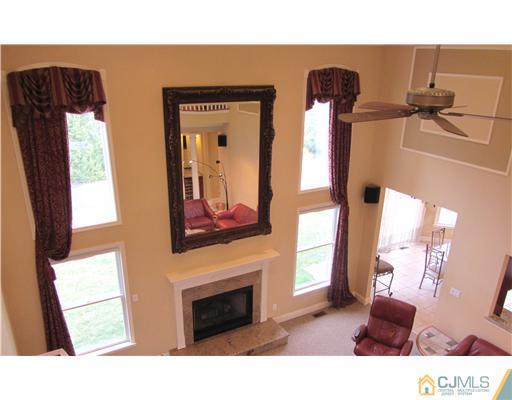 8 Keppel Road Plainsboro, NJ 08536 - Photo 13 of 22 a living room with furniture and a fireplace