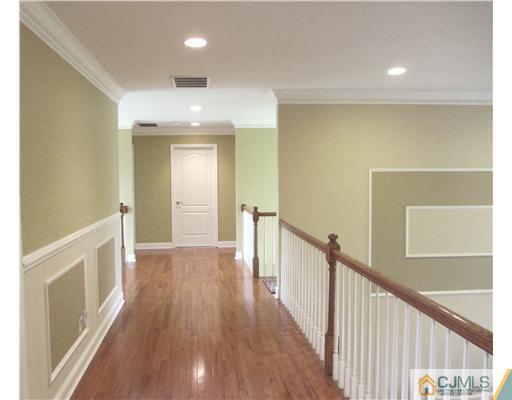 8 Keppel Road Plainsboro, NJ 08536 - Photo 14 of 22 a view of a hallway with wooden floor