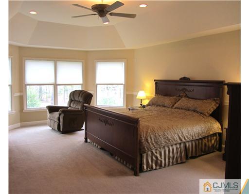 8 Keppel Road Plainsboro, NJ 08536 - Photo 16 of 22 a bedroom with a bed and a couch
