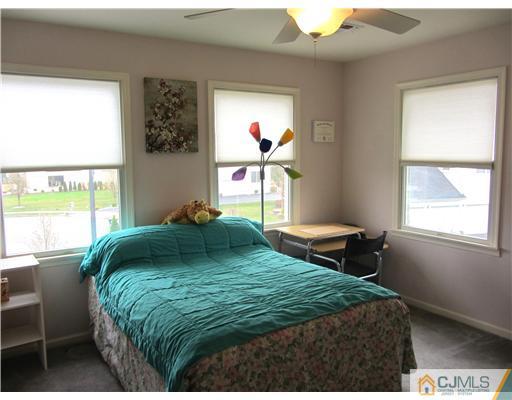8 Keppel Road Plainsboro, NJ 08536 - Photo 19 of 22 a bedroom with a bed and window