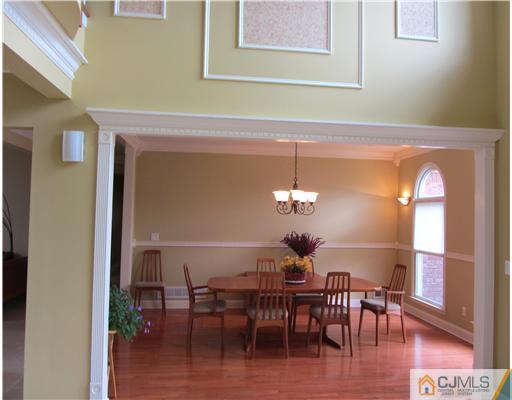 8 Keppel Road Plainsboro, NJ 08536 - Photo 3 of 22 a view of a dining room with furniture and wooden floor