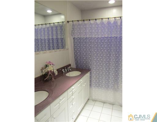 8 Keppel Road Plainsboro, NJ 08536 - Photo 21 of 22 a bathroom with a granite countertop sink a toilet and shower