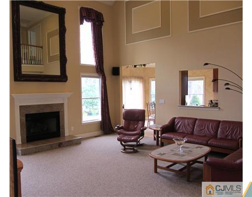 8 Keppel Road Plainsboro, NJ 08536 - Photo 5 of 22 a living room with furniture and a fireplace