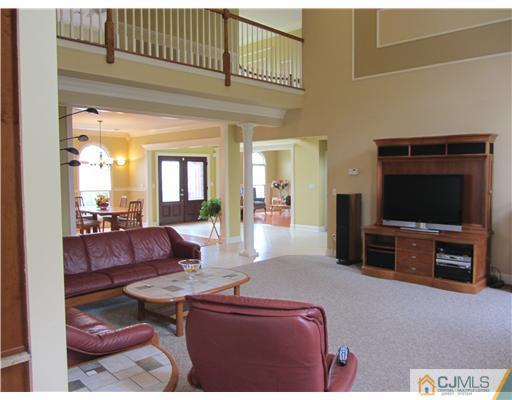 8 Keppel Road Plainsboro, NJ 08536 - Photo 6 of 22 a living room with furniture and a flat screen tv