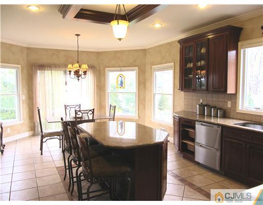 8 Keppel Road Plainsboro, NJ 08536 - Photo 8 of 22 a large kitchen with a table and chairs