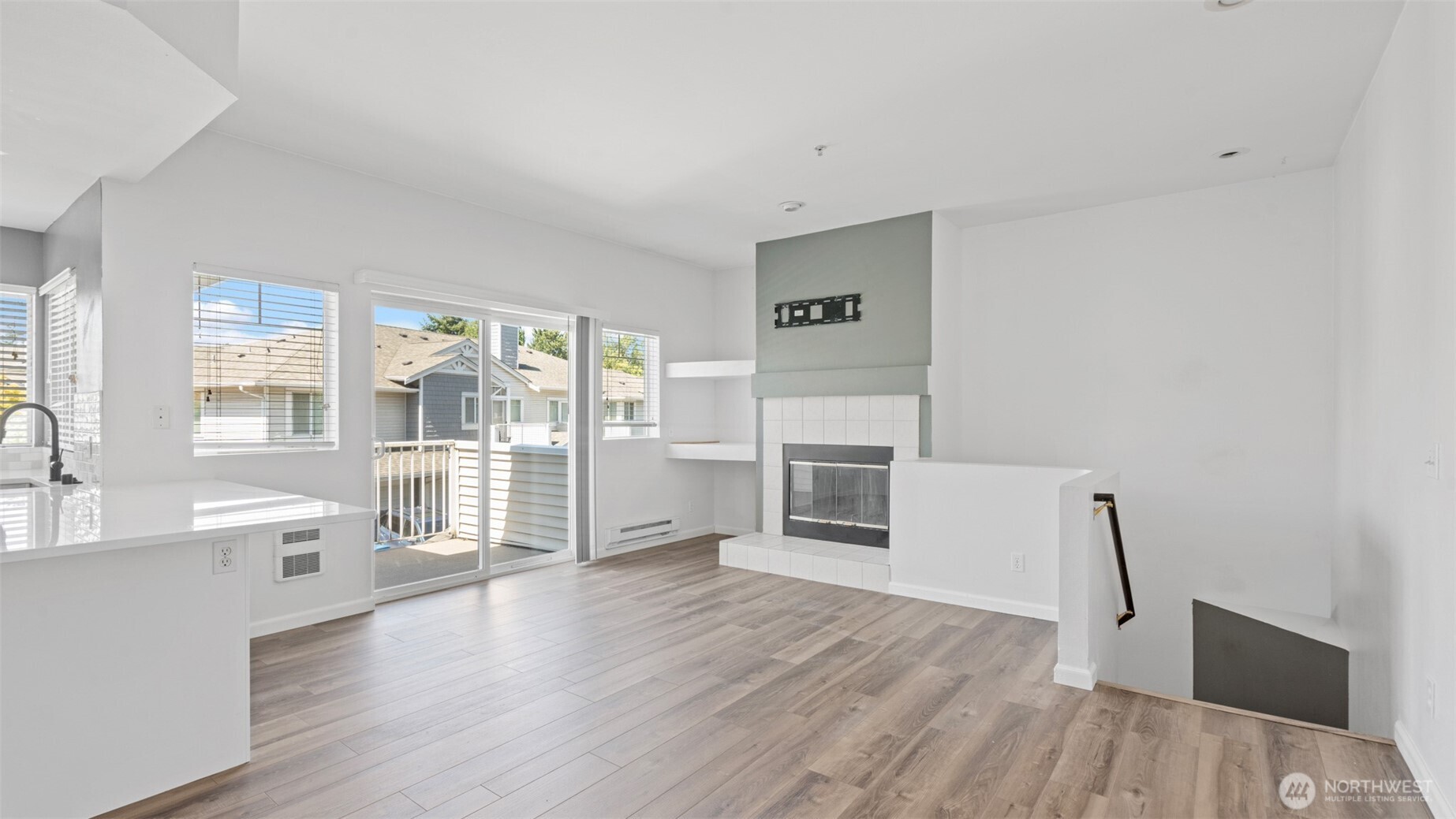 23118 59th Place South, Unit 154 Kent, WA 98032 - Photo 18 of 25 a living room with stainless steel appliances furniture a large window and wooden floor