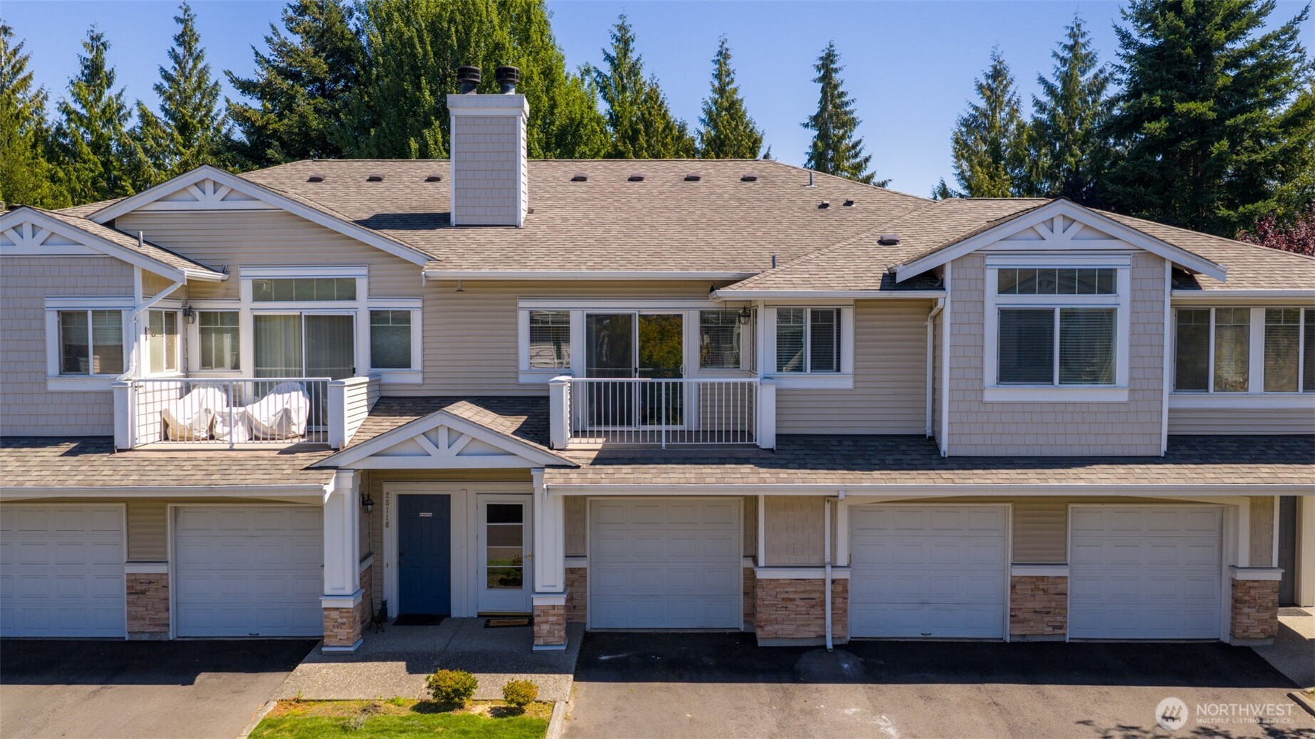 23118 59th Place South, Unit 154 Kent, WA 98032 - Photo 22 of 25 a front view of a house with a yard