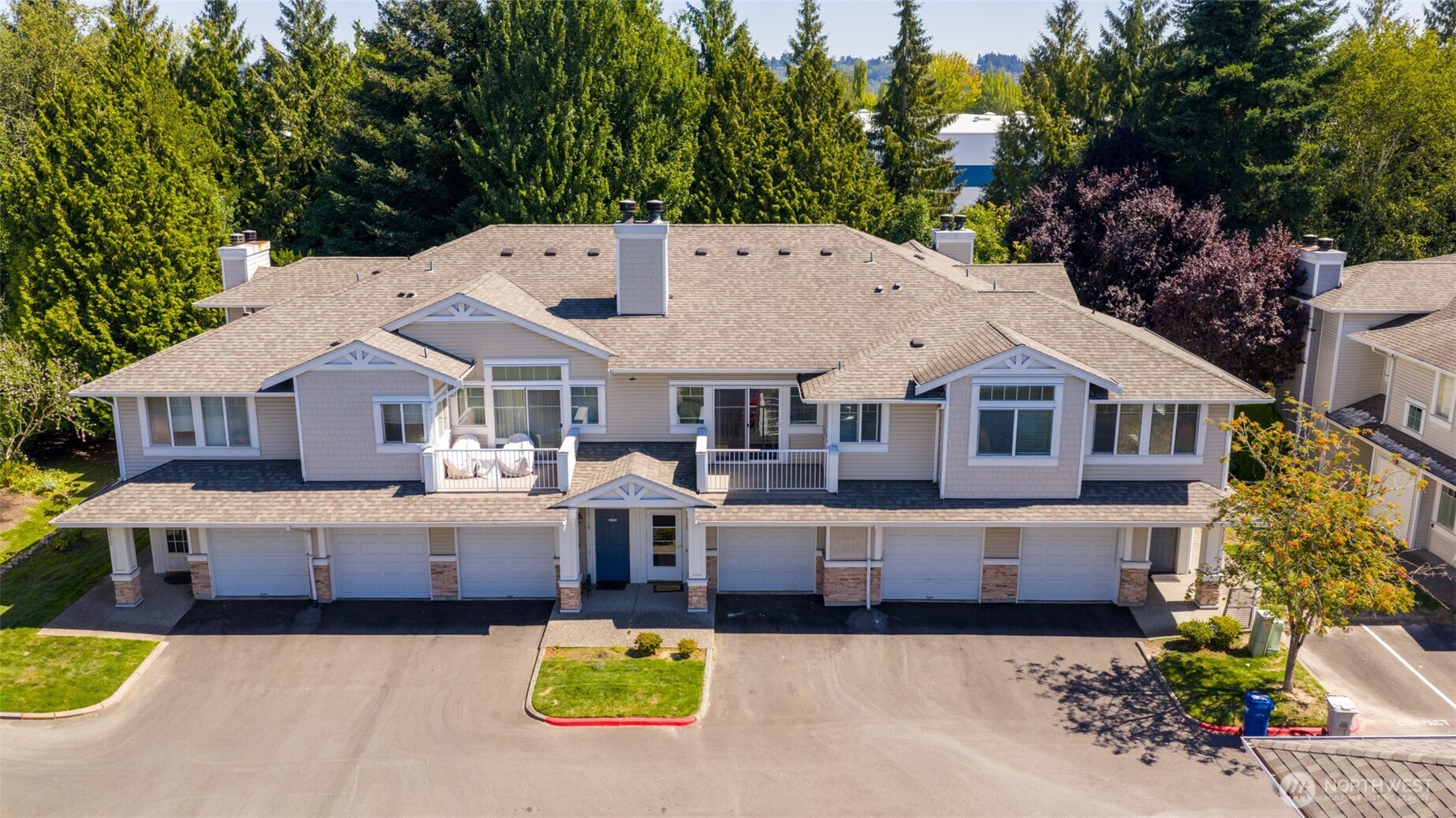 23118 59th Place South, Unit 154 Kent, WA 98032 - Photo 23 of 25 a aerial view of a house with swimming pool and large trees