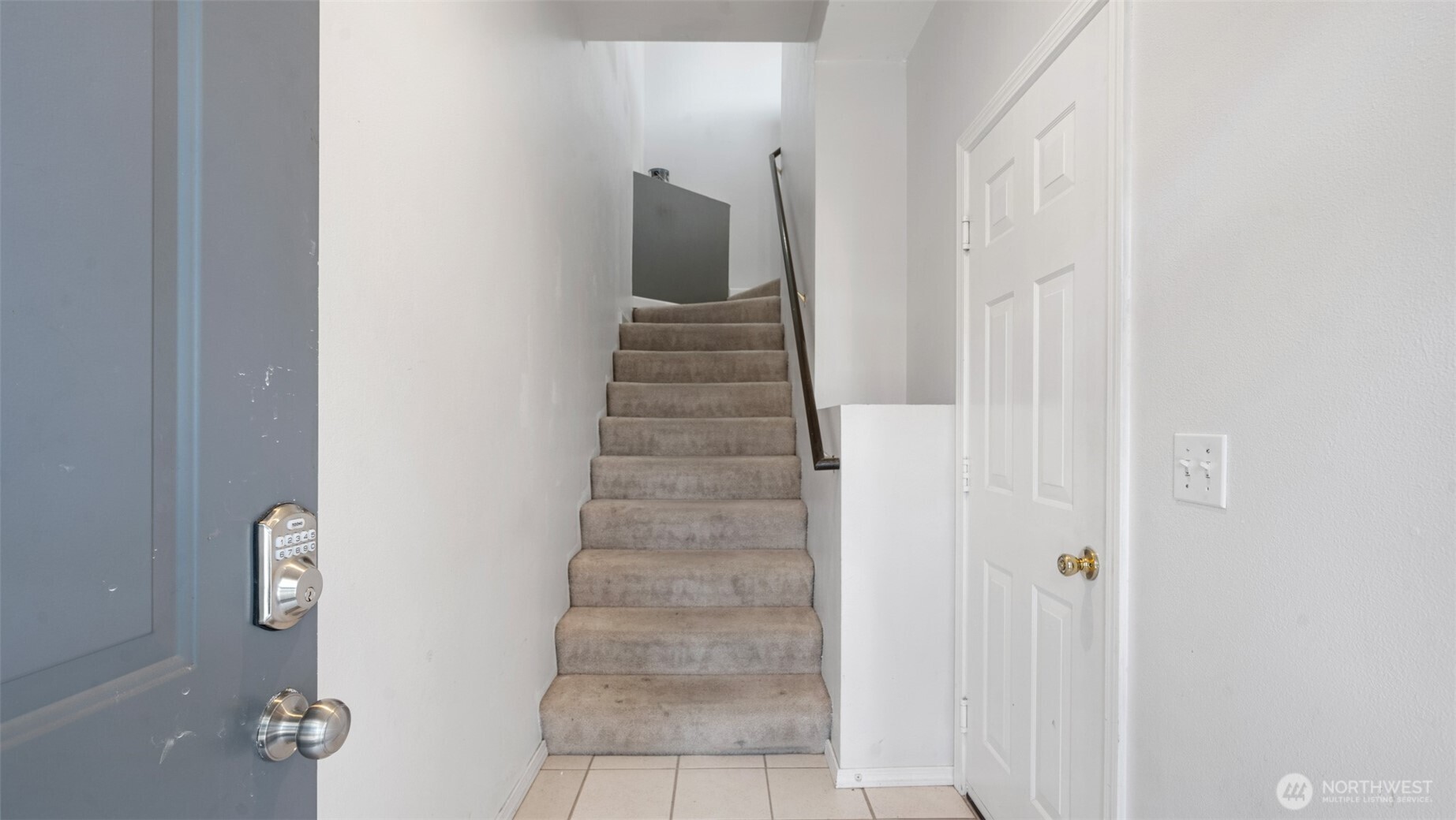 23118 59th Place South, Unit 154 Kent, WA 98032 - Photo 3 of 25 a view of a hallway with stairs