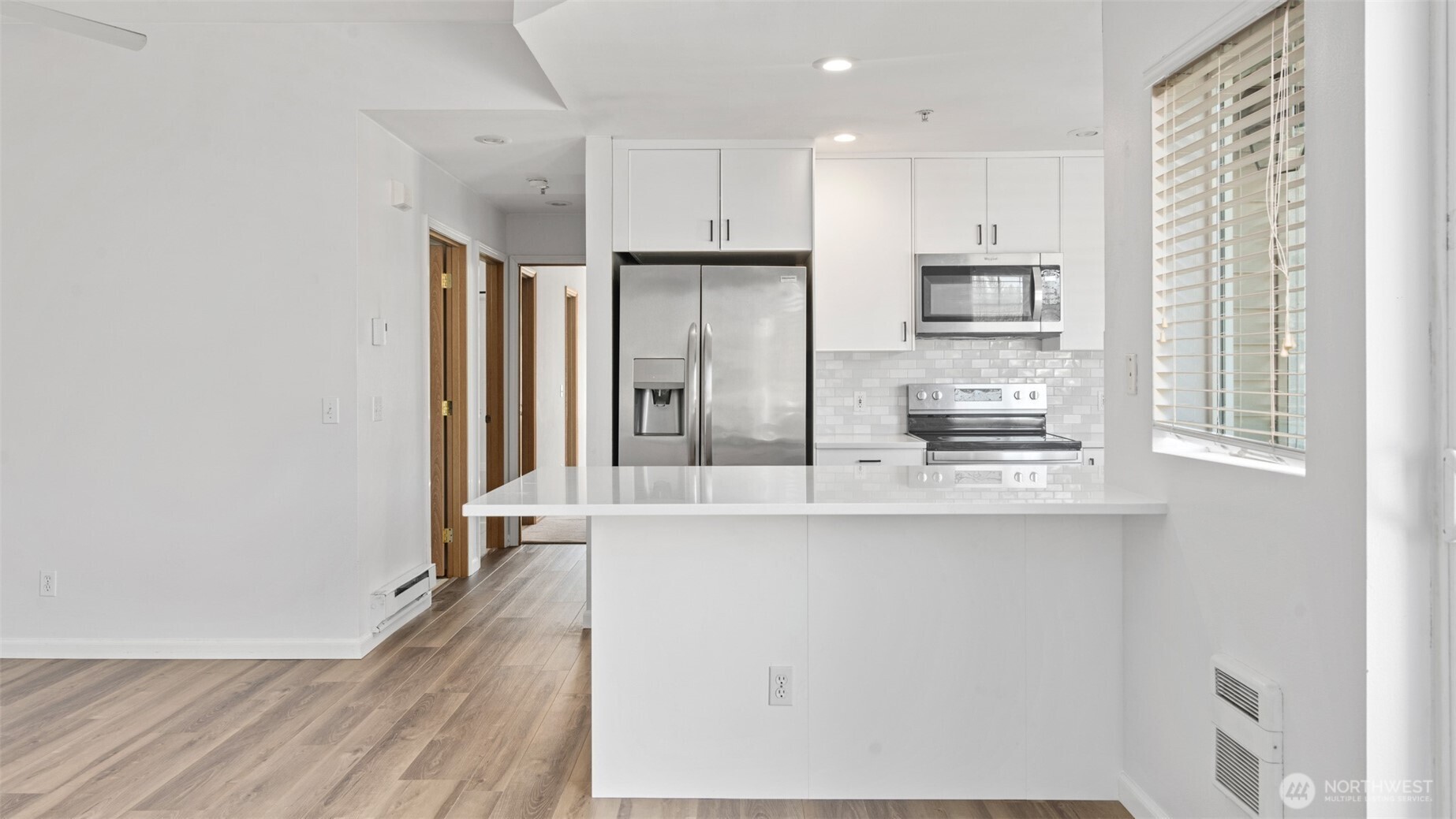 23118 59th Place South, Unit 154 Kent, WA 98032 - Photo 6 of 25 a kitchen with stainless steel appliances a refrigerator and a stove top oven