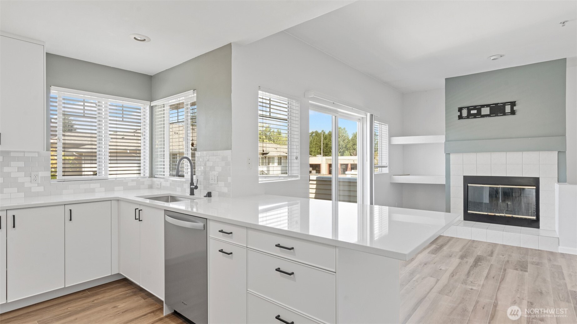 23118 59th Place South, Unit 154 Kent, WA 98032 - Photo 8 of 25 a large white kitchen with a large window