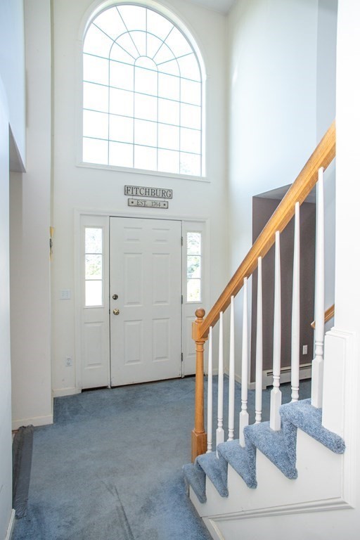 64 Bishop Road Fitchburg, MA 01420 - Photo 13 of 40 a view of staircase with white walls and a window