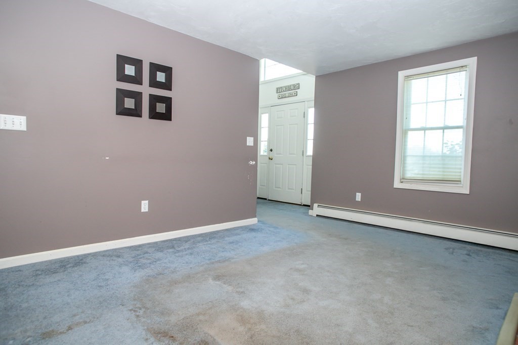 64 Bishop Road Fitchburg, MA 01420 - Photo 14 of 40 an empty room with windows and cabinet