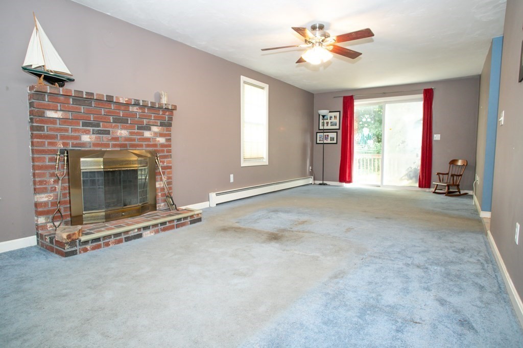 64 Bishop Road Fitchburg, MA 01420 - Photo 15 of 40 a view of an empty room with a fireplace and a window