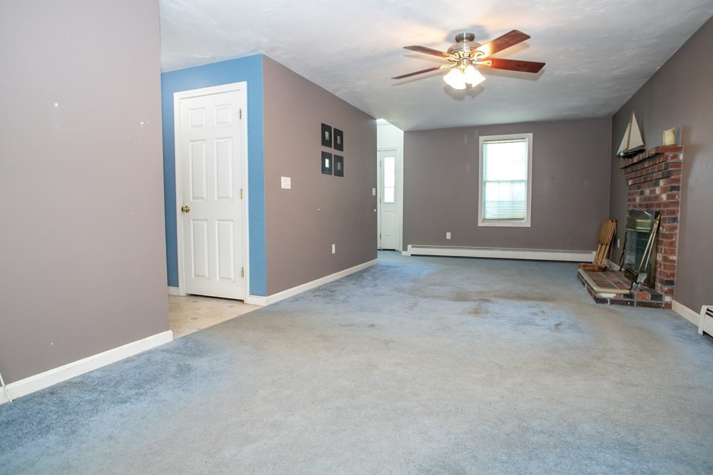 64 Bishop Road Fitchburg, MA 01420 - Photo 17 of 40 a view of a room with a ceiling fan and a window