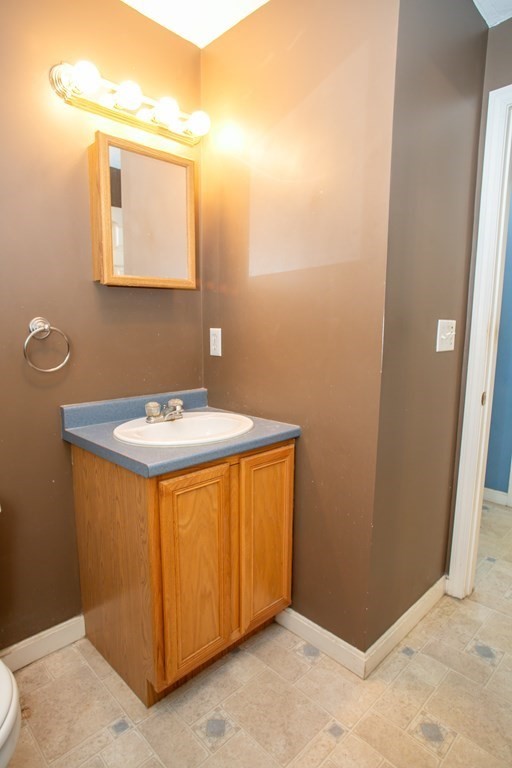 64 Bishop Road Fitchburg, MA 01420 - Photo 19 of 40 a bathroom with a sink and a mirror