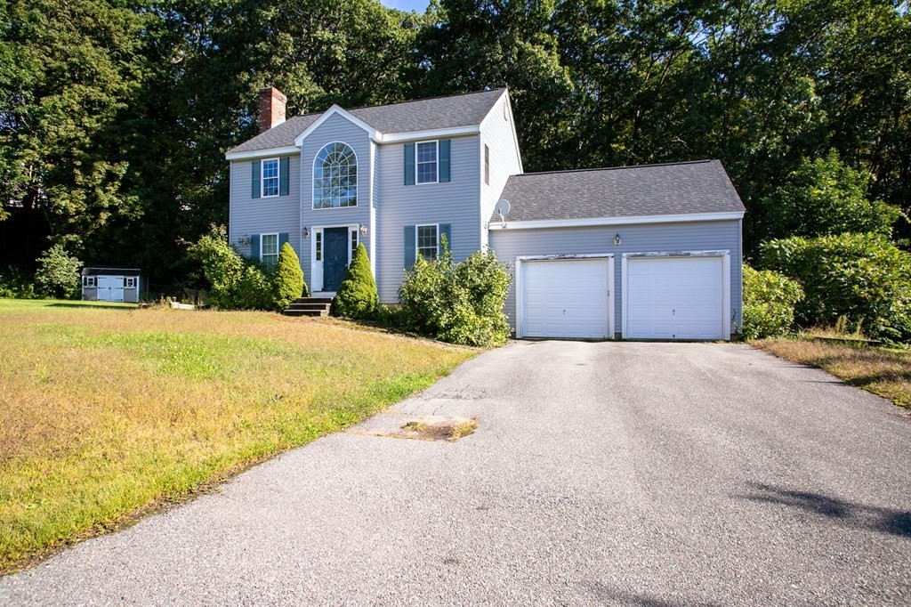64 Bishop Road Fitchburg, MA 01420 - Photo 2 of 40 a front view of a house with a yard and garage