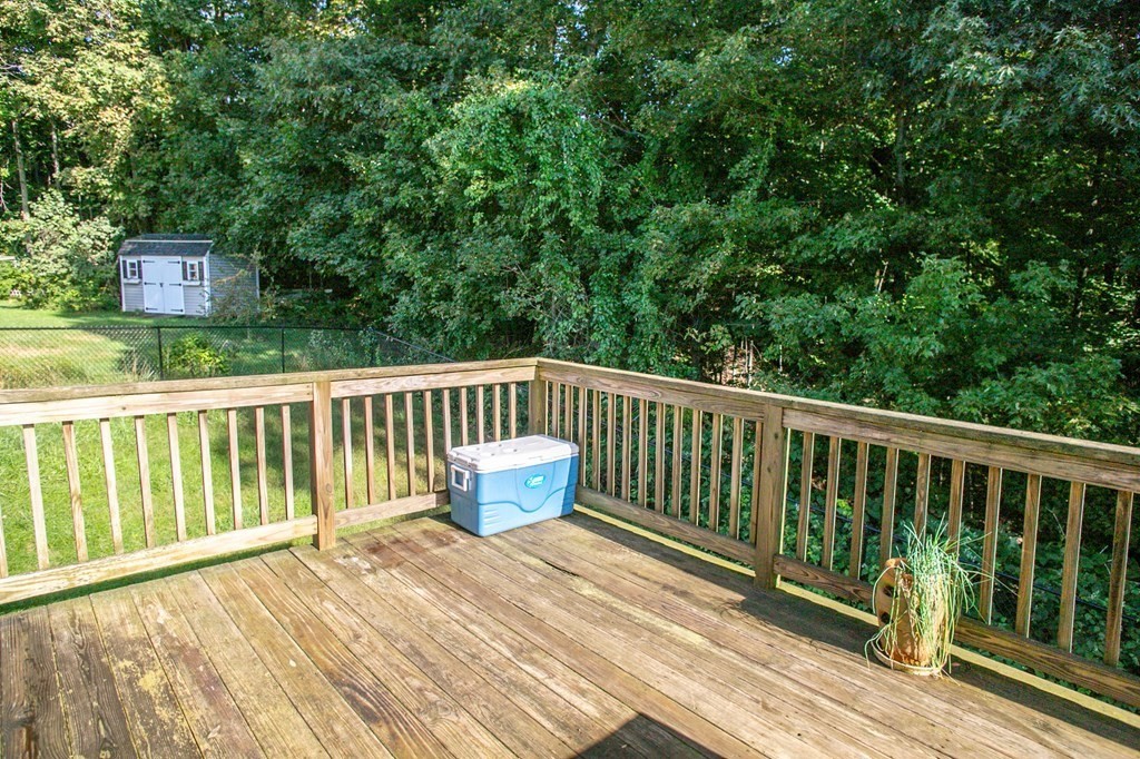 64 Bishop Road Fitchburg, MA 01420 - Photo 23 of 40 a view of balcony with wooden floor and fence