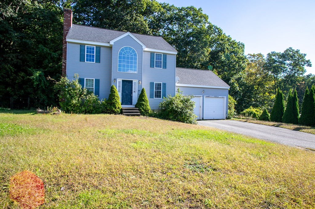 64 Bishop Road Fitchburg, MA 01420 - Photo 3 of 40 a front view of a house with yard and trees