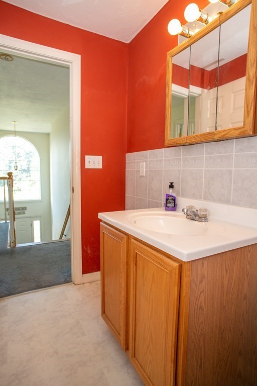 64 Bishop Road Fitchburg, MA 01420 - Photo 32 of 40 a bathroom with a sink and a mirror