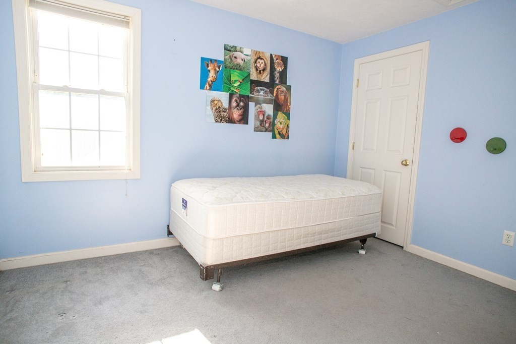 64 Bishop Road Fitchburg, MA 01420 - Photo 33 of 40 a bedroom with a bed and a window