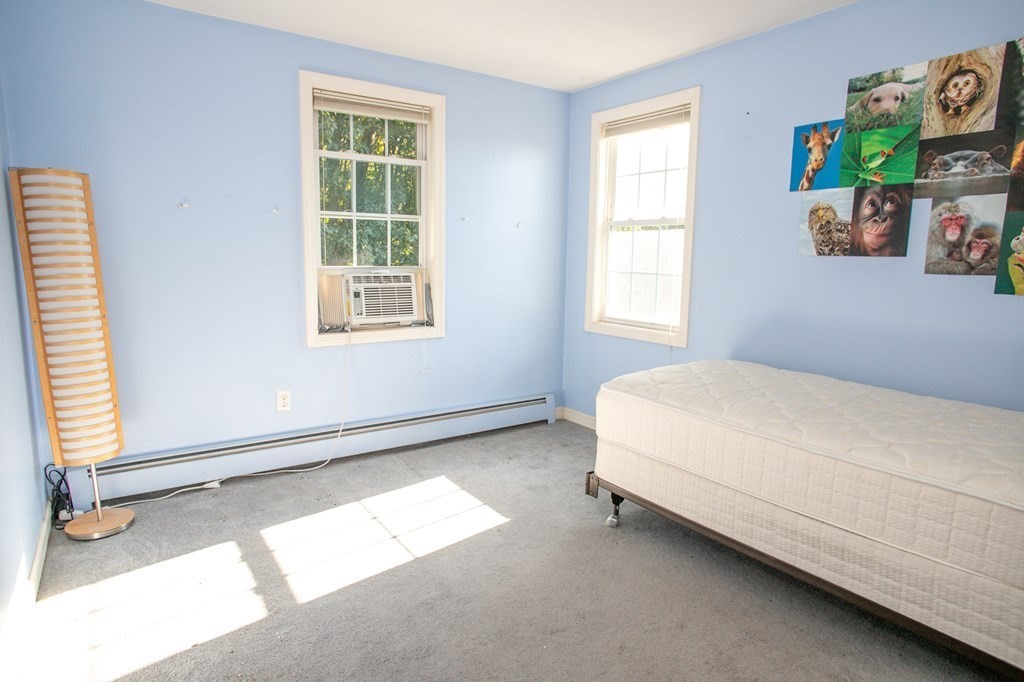 64 Bishop Road Fitchburg, MA 01420 - Photo 34 of 40 a bed sitting in a bedroom next to a window