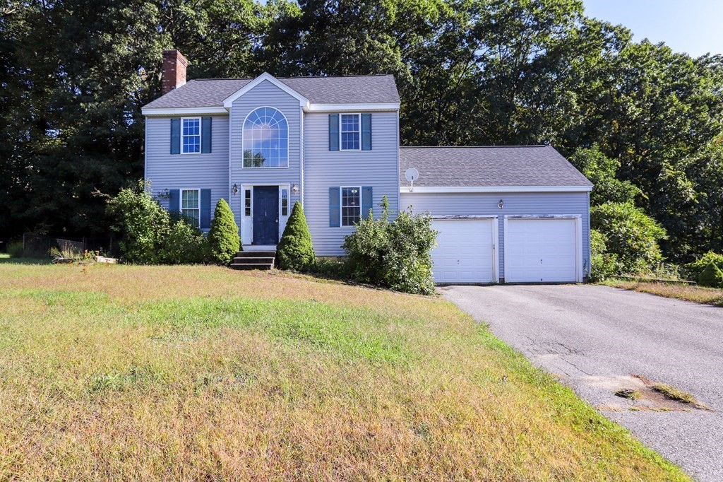 64 Bishop Road Fitchburg, MA 01420 - Photo 40 of 40 a front view of a house with a yard and garage