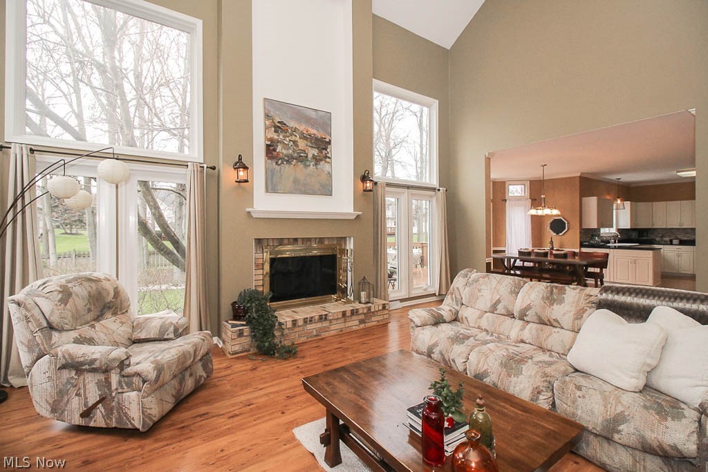 434 Longspur Road Highland Heights, OH 44143 - Photo 13 of 35 The great room boasts a fireplace framed by windows.