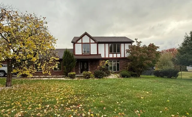 a front view of a house with garden