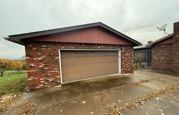 a view of a swimming pool with a yard