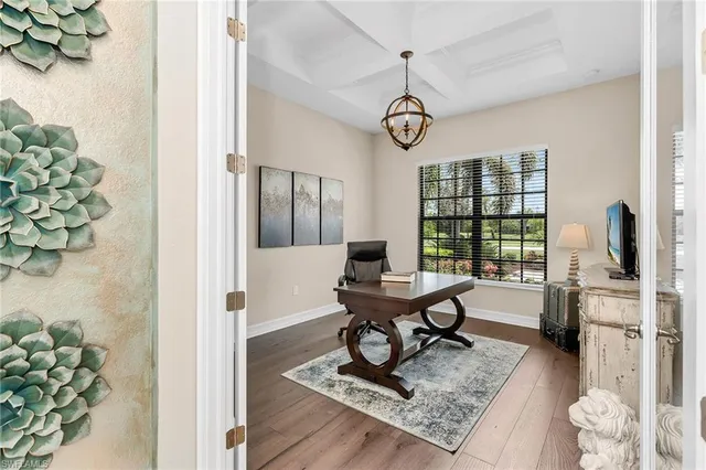 a living room with fireplace furniture and a window